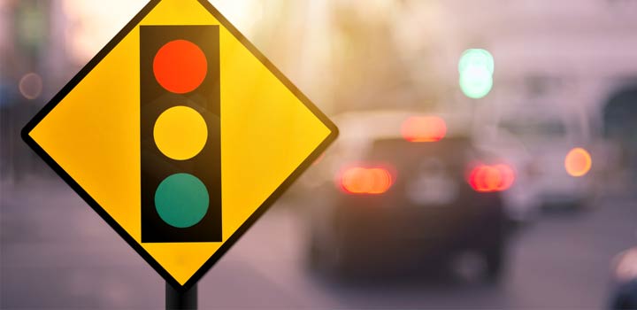 Can I make a left turn at a red traffic signal?